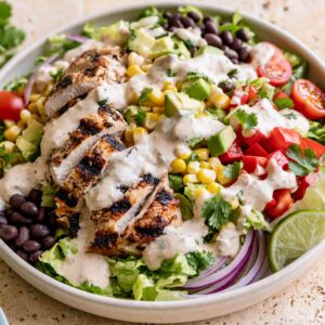 Healthy Southwest chicken salad with grilled chicken and creamy chipotle dressing in a white bowl