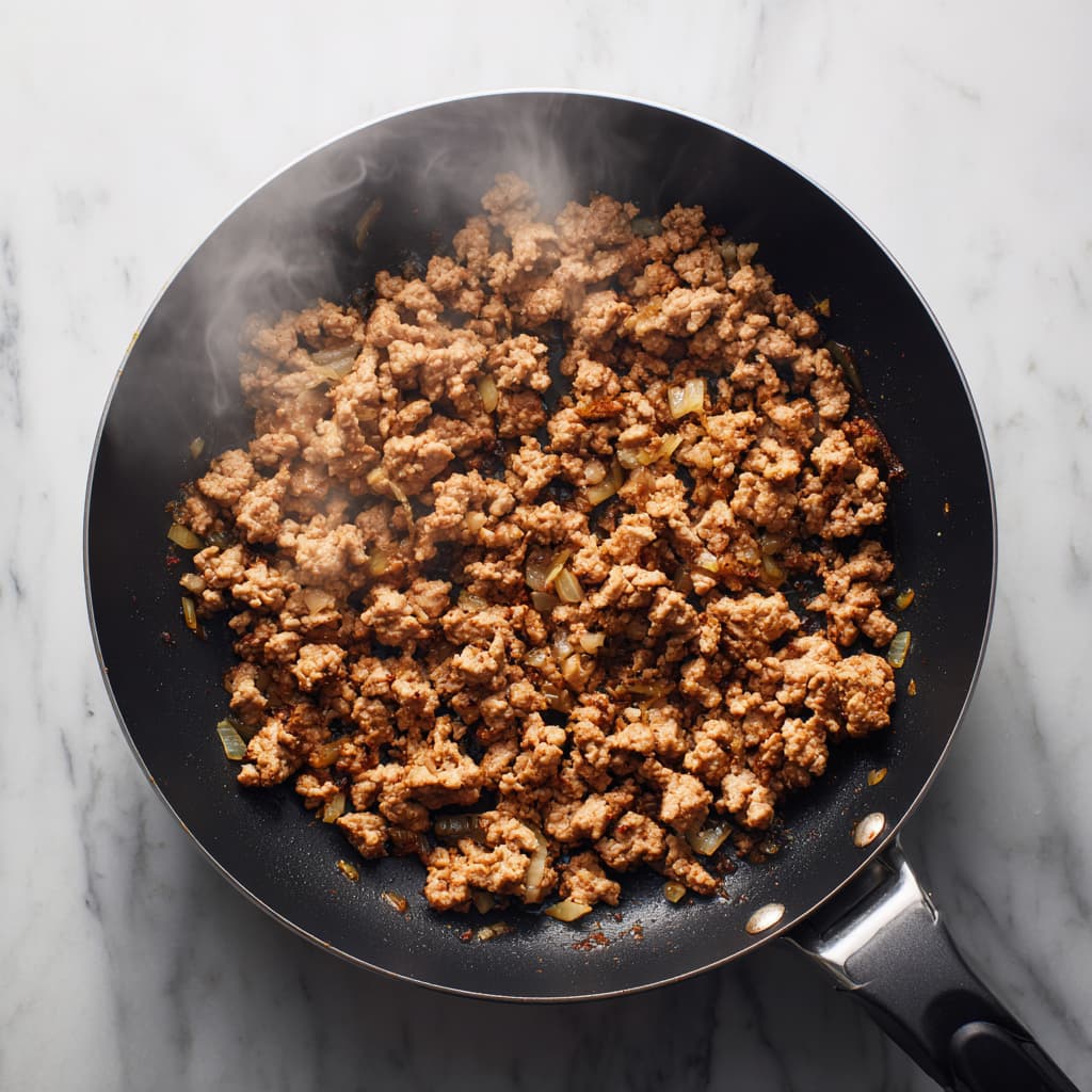 Fresh taco bowl toppings including lettuce, tomatoes, cilantro, and Greek yogurt sauce.