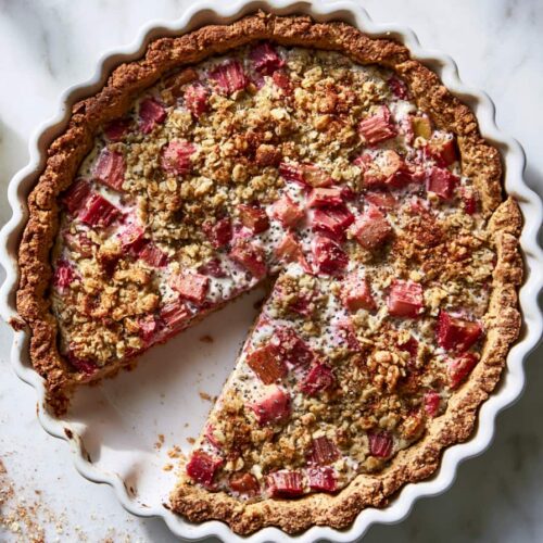 Healthy rhubarb protein pie with oat crust and creamy rhubarb filling served on a plate.