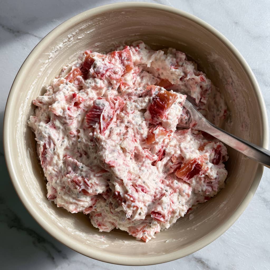 Creamy rhubarb filling mixed with Greek yogurt and protein powder for healthy pie.